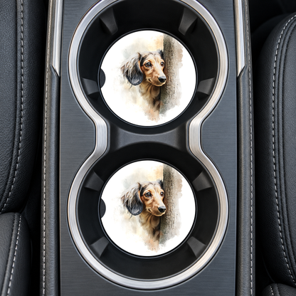 Brown Dachshund Peeking Around Tree sandstone car coasters, installed in car cup holders