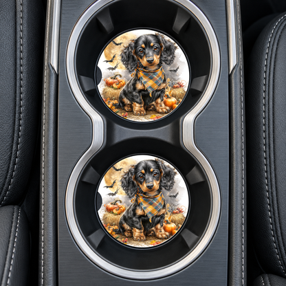 Long-Haired Dachshund Halloween Bats sandstone car coasters, installed in car cup holders